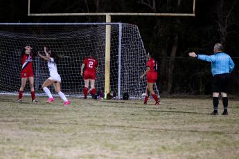 University Christian's Abby Mehm celebrates in front of the Lafayette net after scoring the go-ahead goal in overtime of Tuesday's Region 1-2A quarterfinal. (JACK HOWDESHELL/Special to the Reporter)