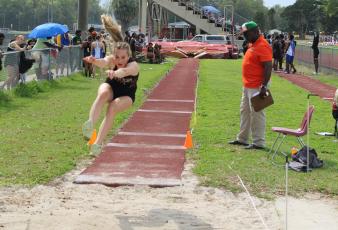 Columbia's Alli Jenkins leaps during the triple jump at the Raider Invitational on Saturday. (COURTESY)