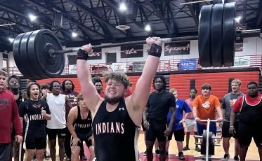 Fort White lifter James Dimauro performs the clean and jerk during Monday's quad meet. (COURTESY)