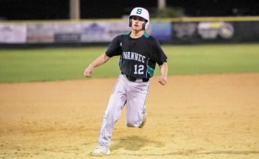 Suwannee's Caiden Jenkins strolls into third base during a game against Columbia on Feb. 29. (BRENT KUYKENDALL/Lake City Reporter)