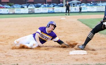 Columbia shortstop Ayden Phillips slides safely into third base during Tuesday’s game against St. Augustine. (BRENT KUYKENDALL/Lake City Reporter)
