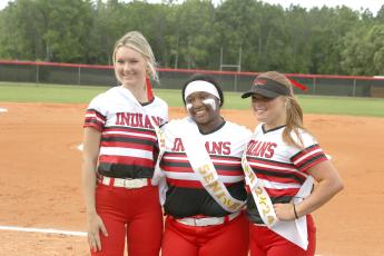 Fort White seniors Carly Caines (from left), N'Coreyia Atkins and Gracie Clemons pose ahead of Thursday's game against Dixie County. (MORGAN MCMULLEN/Lake City Reporter)