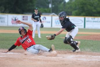 NFC's Jace Riggan slides safely into home plate ahead of a tag from Suwannee catcher Grayson Bonds on Thursday. (PAUL BUCHANAN/Special to the Reporter)