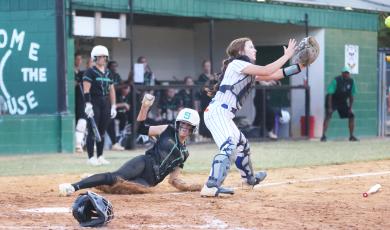 Suwannee’s Rachel Smith slides safely into home plate to score a run against Taylor County during Tuesday’s District 2-3A semifinal. (PAUL BUCHANAN/Special to the Reporter)