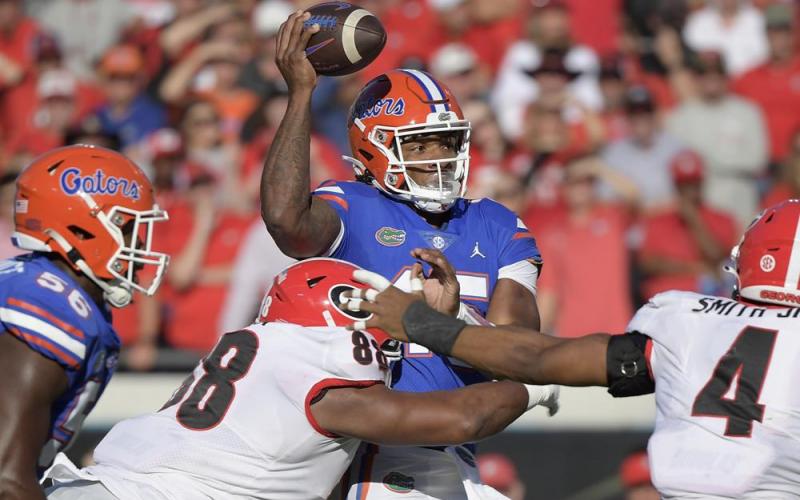 Florida quarterback Anthony Richardson is sacked by Georgia defensive lineman Jalen Carter on Saturday in Jacksonville. (PHELAN M. EBENHACK/Associated Press)