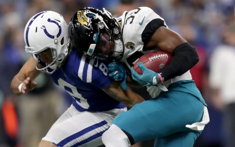 Jacksonville Jaguars wide receiver Jamal Agnew (39) collides with Indianapolis Colts punter Rigoberto Sanchez (8) at Lucas Oil Stadium on Nov. 14 in Indianapolis. (TRIBUNE NEWS SERVICE)