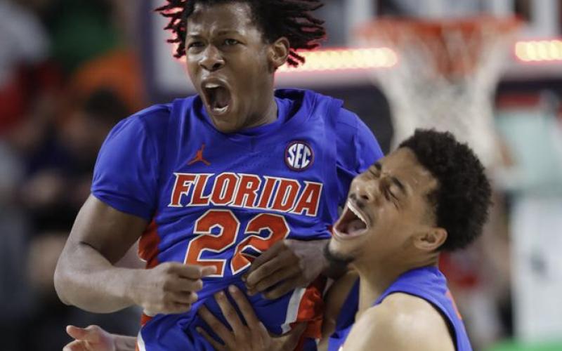 Florida guard Tyree Appleby (22) celebrates with guard Myreon Jones (0) after hitting the game-winning shot against Ohio State at the buzzer on Wednesday in Fort Myers. (SCOTT AUDETTE/Associated Press)