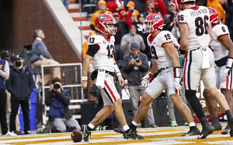 Georgia quarterback Stetson Bennett (13) celebrates with tight end Brock Bowers (19) after scoring a touchdown against Tennessee during Saturday's game in Knoxville, Tenn. (WADE PAYNE/Associated Press)