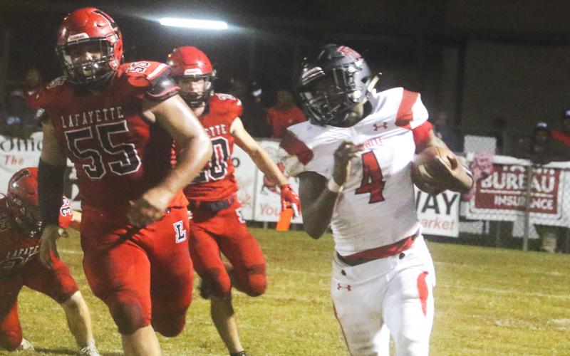 Fort White running back Maliki Clark rushes up the field against Lafayette during Friday’s Region 3-1A quarterfinal. (MORGAN MCMULLEN/Lake City Reporter)