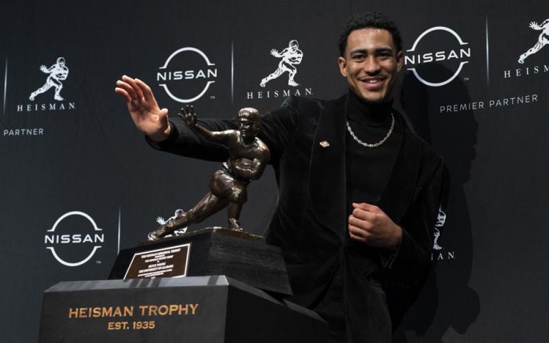 Alabama quarterback Bryce Young poses for a photograph after winning the Heisman Trophy on Saturday in New York. (JOHN MINCHILLO/Associated Press)