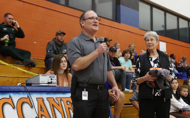 Suwannee County Superintendent Ted Roush (left) offers a few words in honor of forme Branford coach and teacher LeNelle Morgan before the Branford gym is dedicated to her. (PAUL BUCHANON/Special to the Reporter)