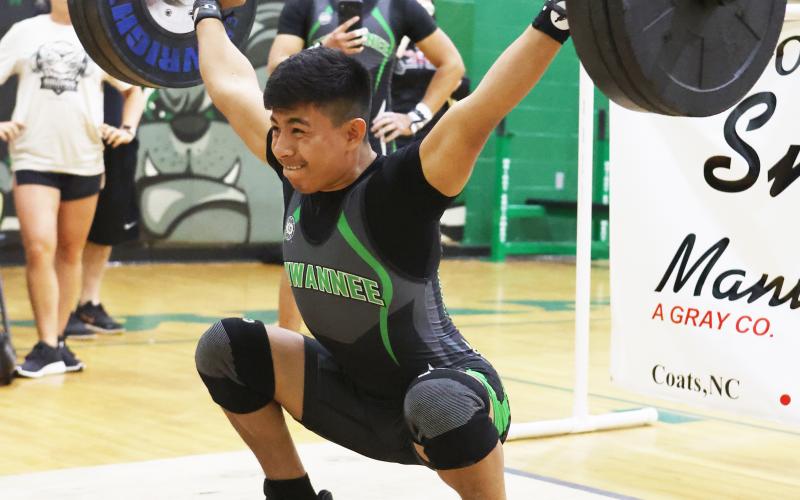 Suwannee’s Yael Hernandez performs the clean and jerk during the Bulldog Invitational on Friday. (PAUL BUCHANAN/Special to the Reporter)