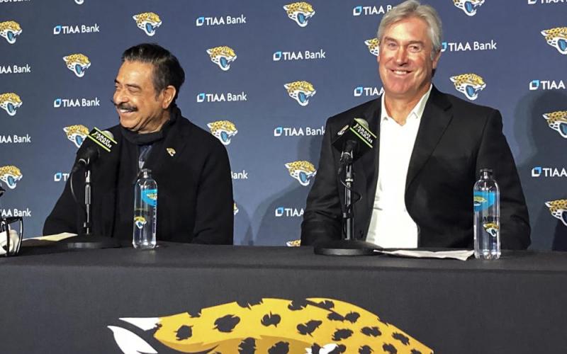 Jacksonville Jaguars owner Shahid Khan (left) and head coach Doug Pederson smile during a news conference on in Jacksonville. (MARK LONG/Associated Press)