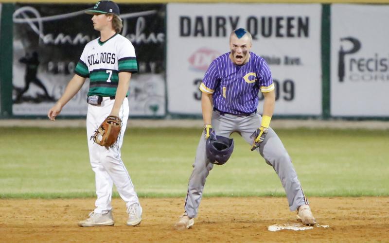 Columbia’s Hayden Gustavson celebrates after hitting a double against Suwannee on Tuesday night. The game was called in the third inning due to rain with the Tigers leading 1-0. A makeup date is to be determined. (BRENT KUYKENDALL/Lake City Reporter)