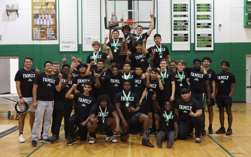 Suwannee’s boys weightlifting team celebrates with the Region 1-2A trophy on Saturday. (PAUL BUCHANAN/Special to the Reporter)