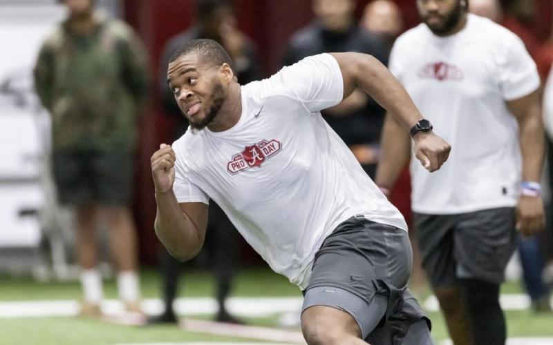 Evan Neal participates in position drills at Alabama's NFL Pro Day on March 30 in Tuscaloosa, Ala. (AP File)