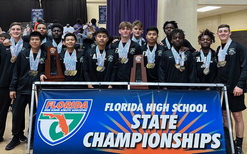 Suwannee lifters pose for a photo with their medals and state championship  trophies Friday afternoon at the Class 2A state championship meet. (COURTESY)