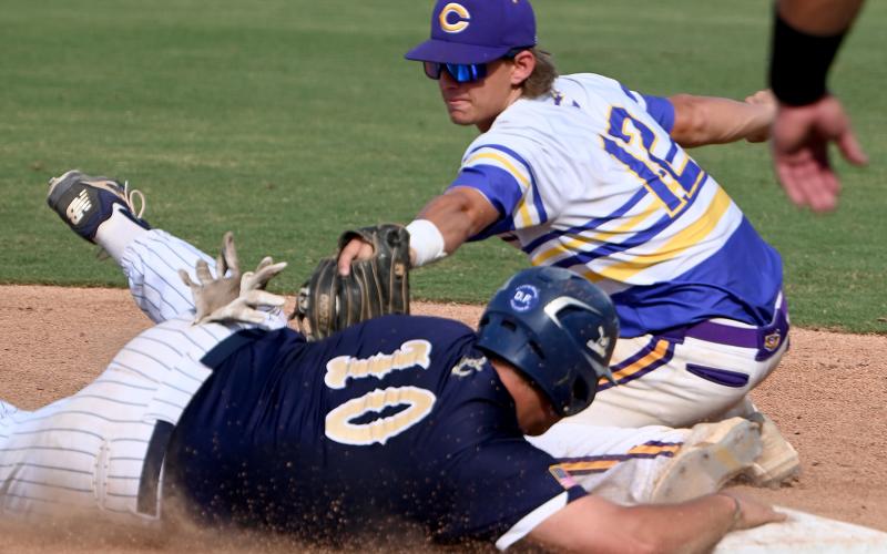 Eau Gallie's Brandon Braggs slides safely into third base before Columbia's Ty Jackson can apply the tag during Thursday's Class 5A state semifinal at Hammond Stadium in Fort Myers. (CHRIS TILLEY/Special to the Reporter)