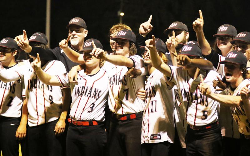Fort White’s baseball team celebrates after defeating Lafayette 3-2 to win the Region 3-1A title on Friday night. (MORGAN MCMULLEN/Lake City Reporter)