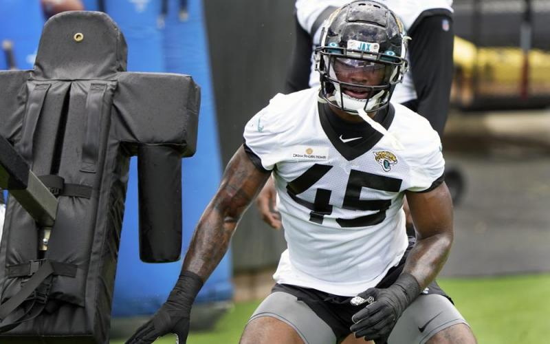 Jacksonville Jaguars defensive lineman K'Lavon Chaisson performs a drill during Tuesday's practice in Jacksonville. (JOHN RAOUX/Associated Press)