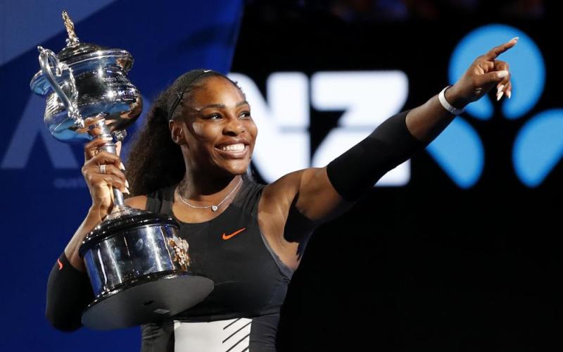 Serena Williams holds her trophy after defeating her sister Venus during the women's singles final at the Australian Open on Jan. 28, 2017, in Melbourne, Australia. (AP FILE)