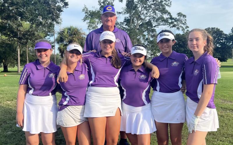 Pictured is this year’s Columbia girls golf team: Megan Ruwe (from left), Veona Osborne, Ashley Nelson, Karlee Gainey, Alison O’Brien and Sydney Jones. Head coach Chet Carter is pictured above.