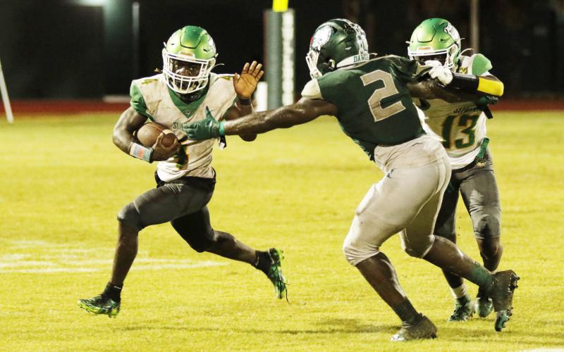 Suwannee running back Marquavious Owens tries to escape a tackle against Flagler Palm Coast last Friday. (JAMIE WACHTER/Lake City Reporter)