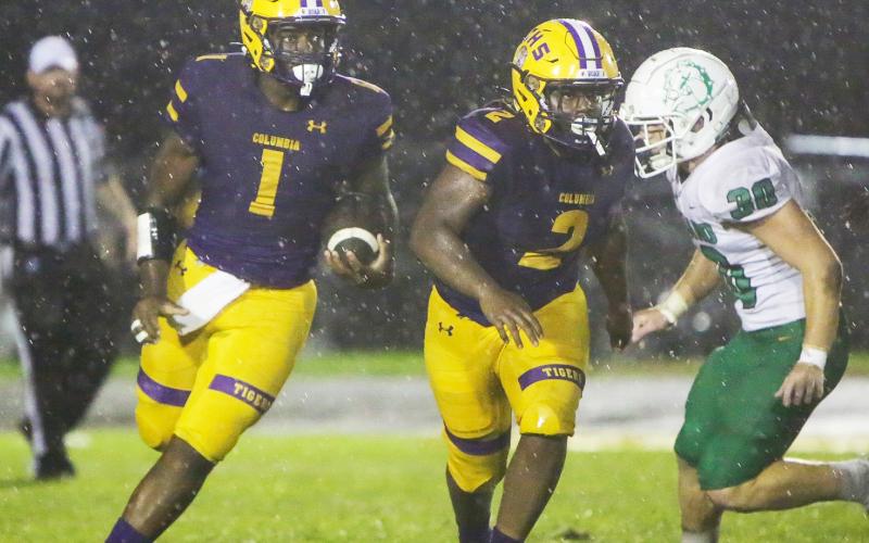 Columbia quarterback Tyler Jefferson rushes on a QB keeper against DeLand on Friday. (BRENT KUYKENDALL/Lake City Reporter)