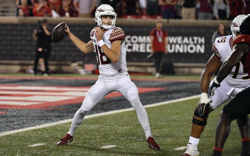 Florida State quarterback Tate Rodemaker (18) looks for a receiver during Friday’s game against Louisville. (TIMOTHY D. EASLEY/Associated Press)