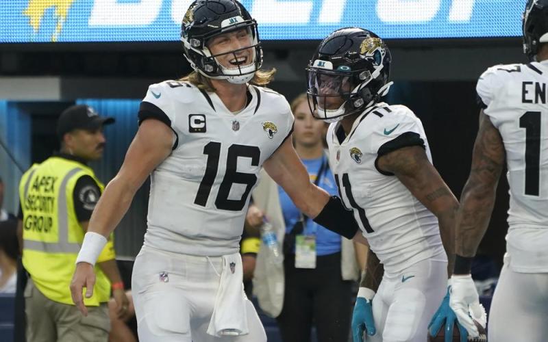 Jacksonville Jaguars quarterback Trevor Lawrence (16) and wide receiver Marvin Jones Jr. celebrate after connecting on a touchdown pass during Sunday’s game the Los Angeles Chargers in Inglewood, Calif. (MARCIO JOSE SANCHEZ/Associated Press)