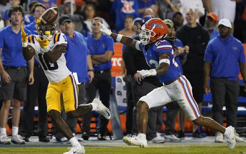 LSU wide receiver Jaray Jenkins, left, makes a reception in front of Florida cornerback Jaydon Hill for a 54-yard touchdown on Oct. 15 in Gainesville. (JOHN RAOUX/Associated Press)
