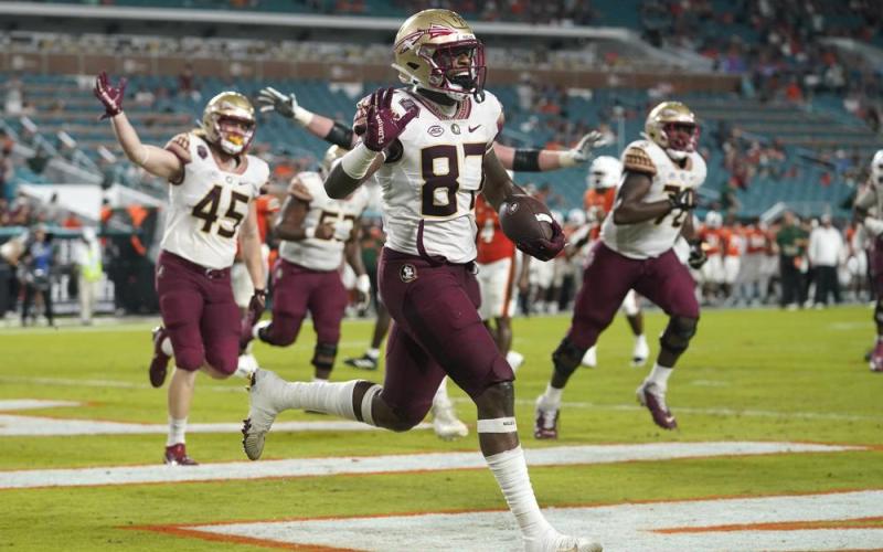 Florida State tight end Camren McDonald (87) celebrates after scoring a touchdown against Miami on Saturday in Miami Gardens. (LYNNE SLADKY/Associated Press)
