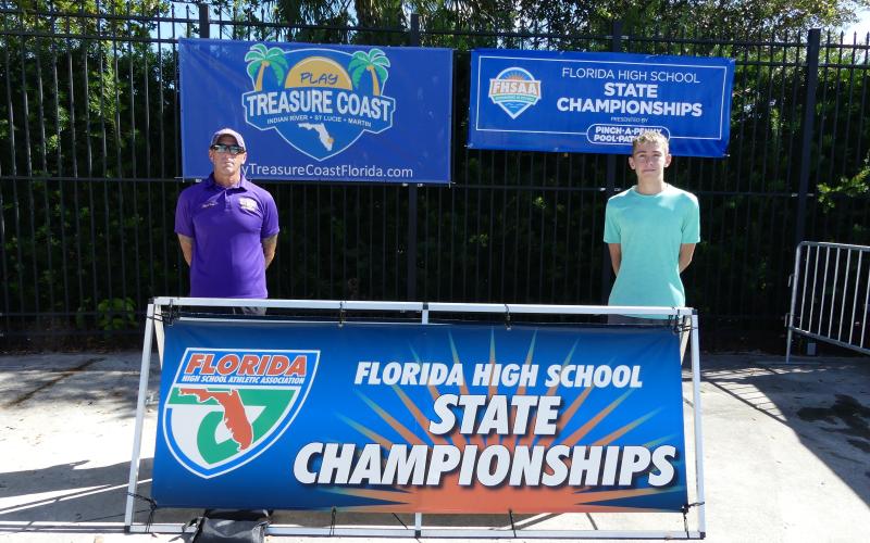 Columbia head coach Shawn Rost (left) and swimmer Ian Disosway (right) at the Class 3A state meet on Friday. (COURTESY)
