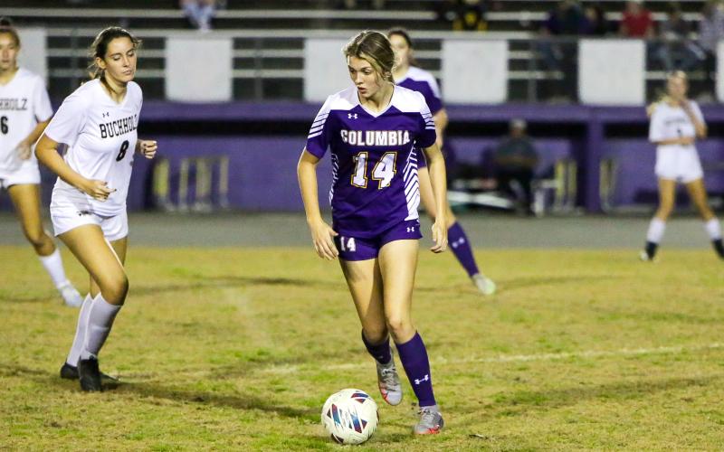 Columbia's Mia Brasel dribbles up the field against Buchholz on Jan. 3. (BRENT KUYKENDALL/Lake City Reporter)