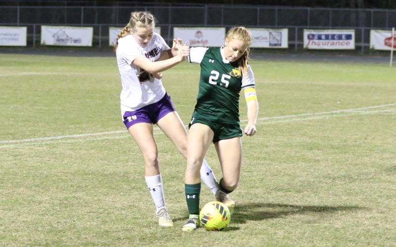 Lecanto’s Mallory Mushlit fights off Columbia’s Kyndall Norris to corral possession of the ball during Tuesday’s Region 1-5A quarterfinal. (MORGAN MCMULLEN/Lake City Reporter)
