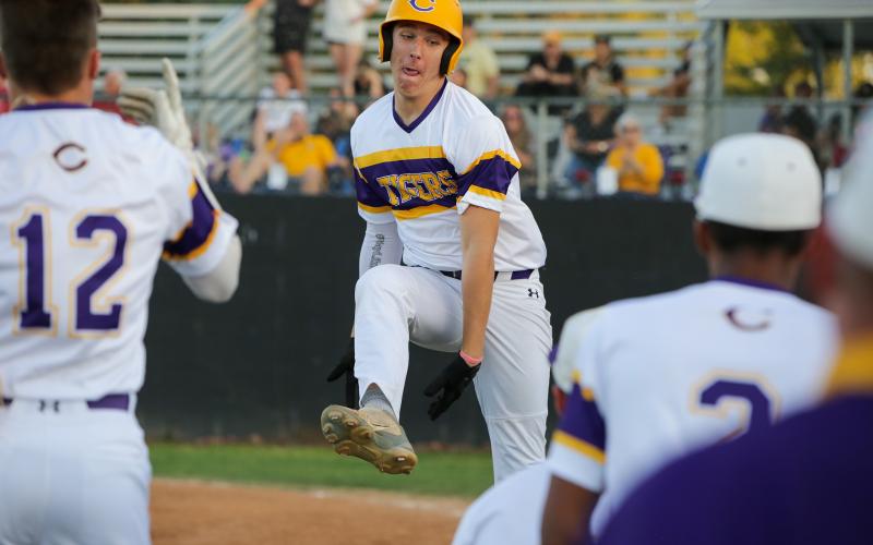 Columbia third baseman Ayden Phillips celebrates after hitting a two-run home run against Buchholz on Tuesday night. (BRENT KUYKENDALL/Lake City Reporter)