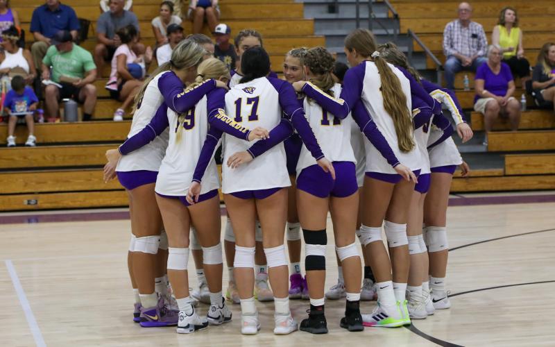 Columbia huddles prior to a tri-match against Branford and Valdosta on Aug. 22. (BRENT KUYKENDALL/Lake City Reporter)