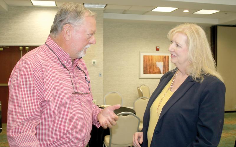 Konnie Patke talks with Carl King at a meet and greet on Nov. 1. Patke has accepted the job as Columbia County’s Tourist Development Council director. (FILE)