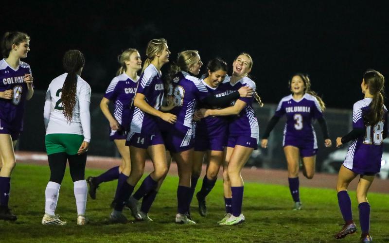 Columbia players celebrate with Carla Medina-Rodriguez (second from right) after she scored a goal against Suwannee on Thursday night. (BRENT KUYKENDALL/Lake City Reporter)