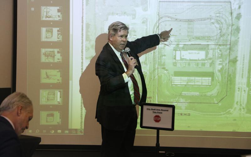 Guy Norris, an attorney for Florida Gateway Hotels, points to a rendering of the proposed Circle K expansion on Centurion Court during a special Planning and Zoning board meeting Wednesday. (MORGAN MCMULLEN/Lake City Reporter)
