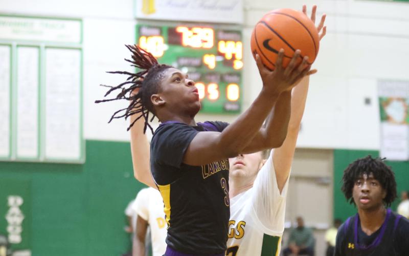 Columbia guard Zamarion Jones rises to shoot against Suwannee on Tuesday night. (PAUL BUCHANAN/Special to the Reporter)