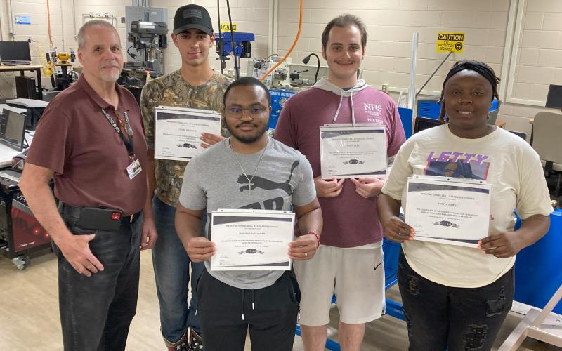 Four North Florida College students received certification from the college’s Industrial Machinery Maintenance 1 program. Pictured are, in front, Rashaun Alexander (from left) and TeKeya Jones; back row, instructor Bill Eustace (from left), Toby Woloszyn and Wyatt Liles. (COURTESY)