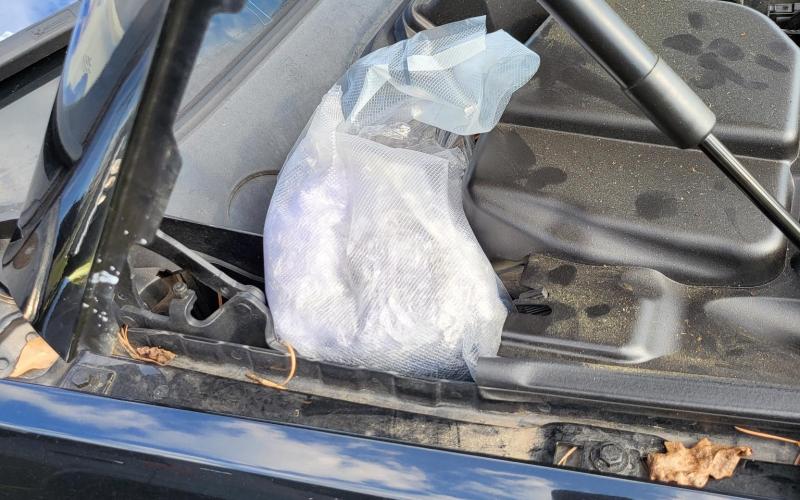 Four pounds of methamphetamine were found beneath the hood of a car pulled over Wednesday on Interstate 75 for a busted windshield. (COURTESY)