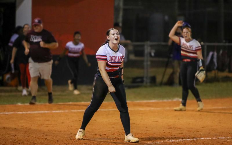 Fort White pitcher Kadence Compton celebrates after finishing her complete-game victory over Madison County on Thursday in the Region 3-1A semifinals. (BRENT KUYKENDALL/Lake City Reporter)