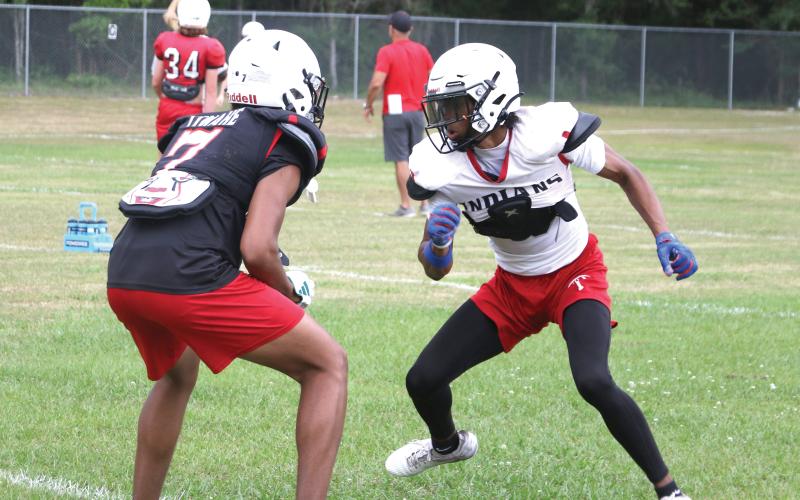 Fort White receiver Mike Peterson Jr. starts a route against corner Tafari Moe during Wednesday’s practice. (MORGAN MCMULLEN/Lake City Reporter)