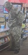 The suspect wore a camouflage jacket and camouflage pants during the robbery. (COURTESY)