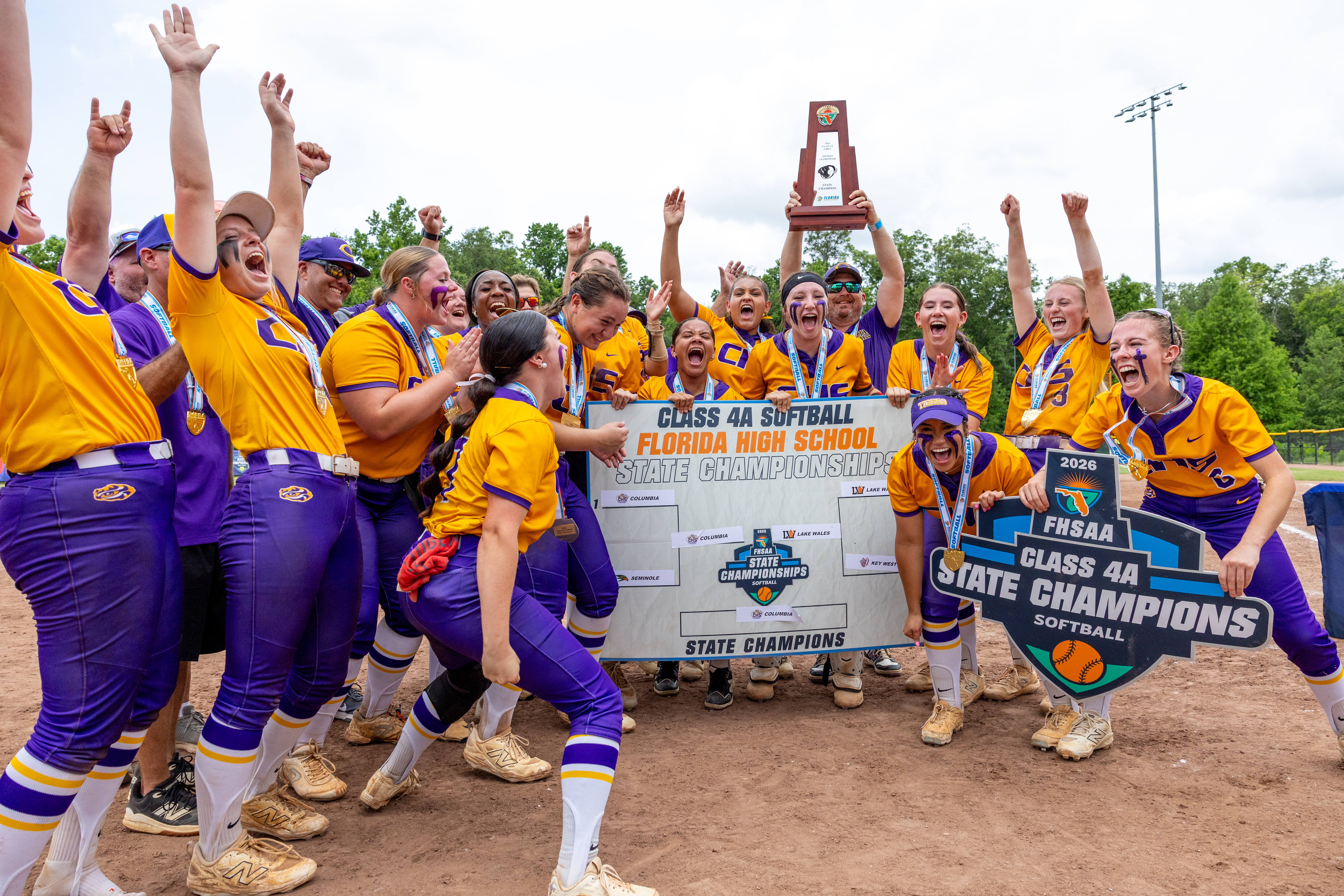 Columbia's softball team celebrates after Ryleigh Stone (77) advanced the Tigers on the Class 4A Final Four bracket following their 3-2 win over Lake Wales in the Class 4A state championship on Saturday. (JACK HOWDESHELL/Lake City Reporter)