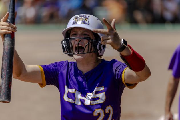 Columbia catcher Emily Delgado encourages the CHS student section to get up for her team after scoring a run following her RBI double in the seventh inning of Thursday's Class 4A state semifinal against Seminole. (JACK HOWDESHELL/Lake City Reporter)