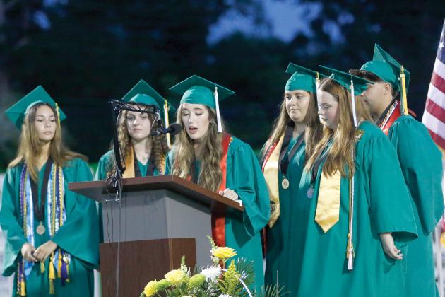 Suwannee High’s Kynzie Hall delivers part of the Salute to Parents during commencement as she is joined by Andrea Baez, Rylee Bonds, Mackenzie Champagne, Elise Mudd and Kolby Riegel. (JAMIE WACHTER/Lake City Reporter)