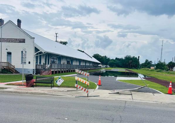 Water sits on top of the parking improvements at the Heritage Square redevelopment area on Tuesday after recent rains. The flooding is due to the project not yet being finished, according to city staff. (COURTESY)